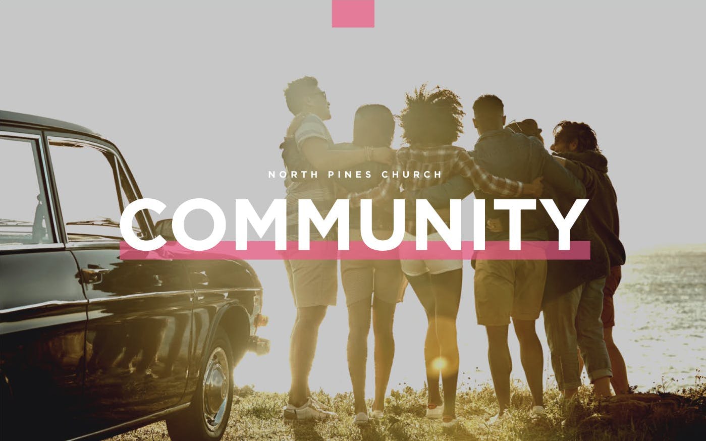 Group of friends huddling together with the text Community overlaying picture.