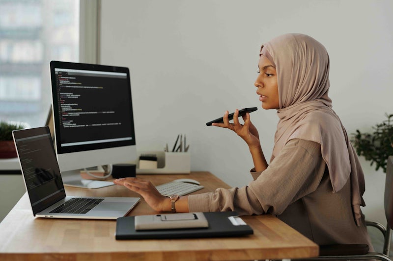 Asian female software developer in troubleshooting role