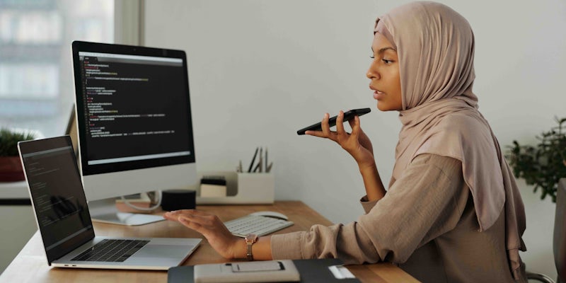 Asian female software developer in troubleshooting role