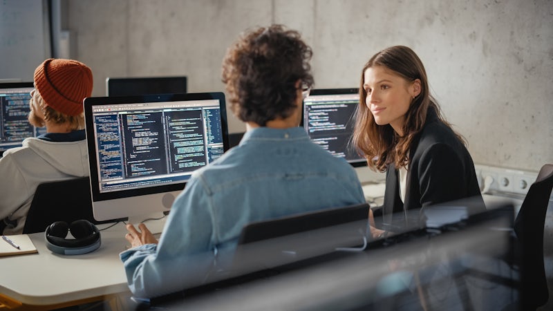 Two people coding in Python