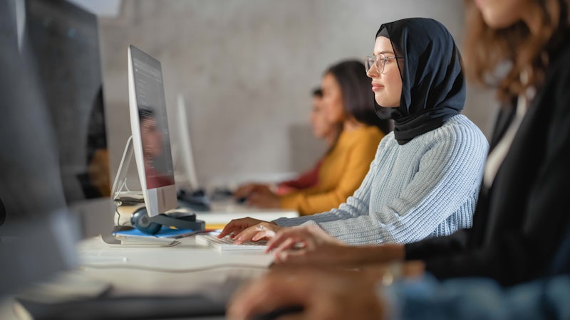 Female programmer working on code