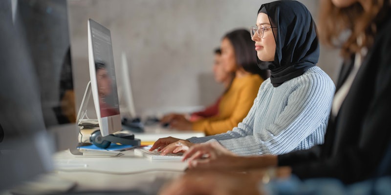 Female programmer working on code