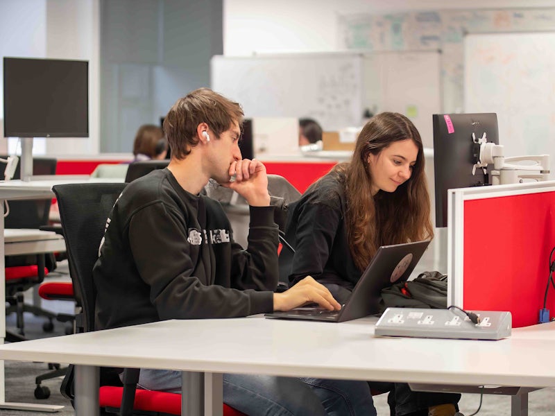 People coding in Manchester office
