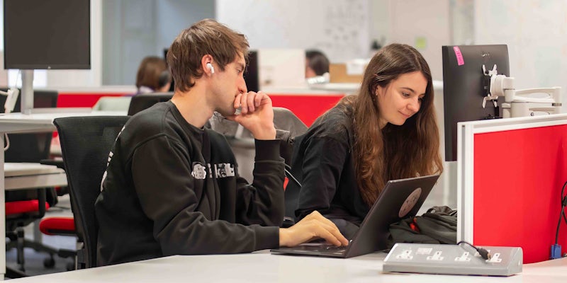People coding in Manchester office