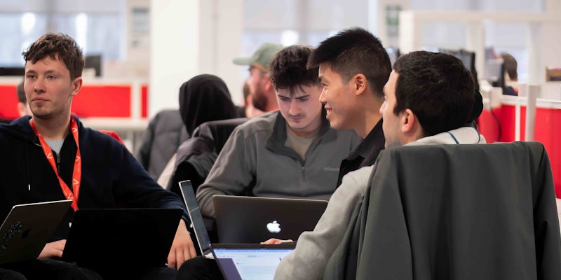 Group of people coding for a group project