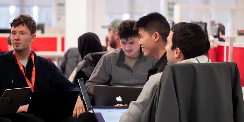 A group of Northcoders student coding on their laptops