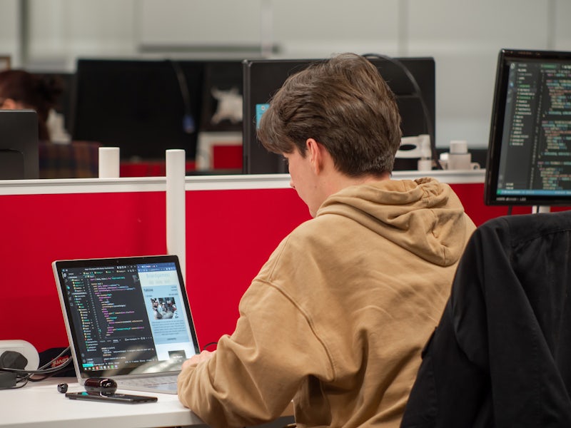Northcoders student typing code on laptop