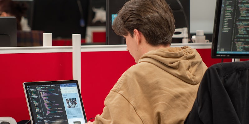 Northcoders student typing code on laptop