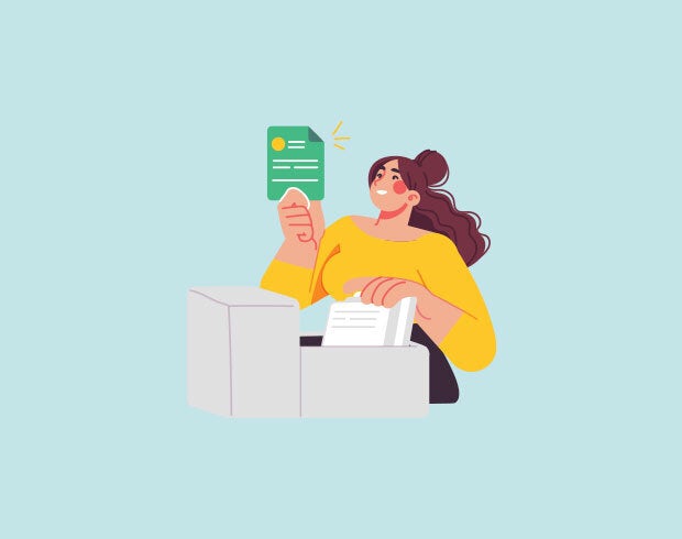 A woman in a yellow shirt with long brown hair, pulls a green card out of a filing cupboard. She smiles and looks excited at finding the document.