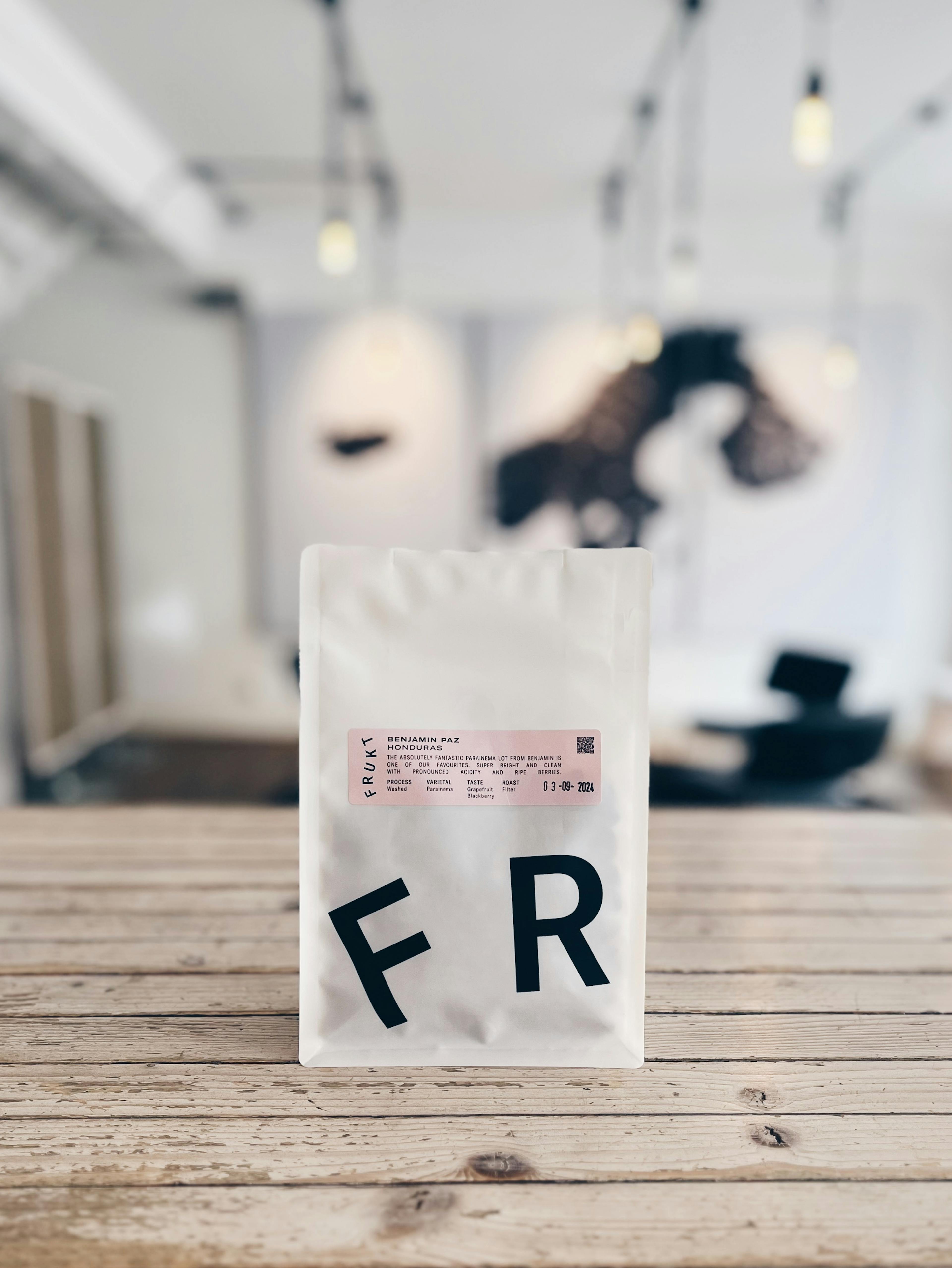 A bag of specialty coffee from Frukt on a counter