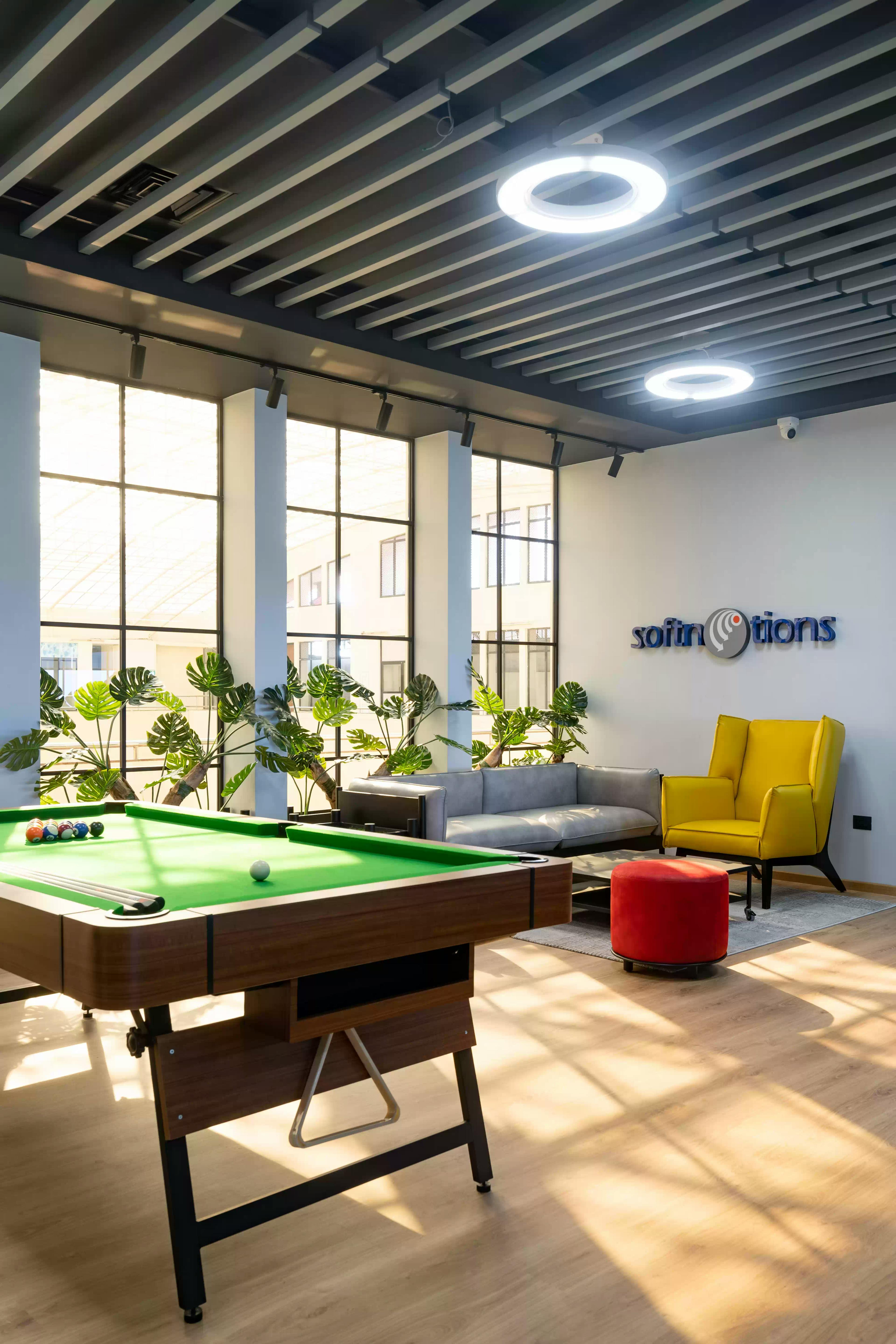 Cozy lounge space with a pool table and a warm atmosphere.
