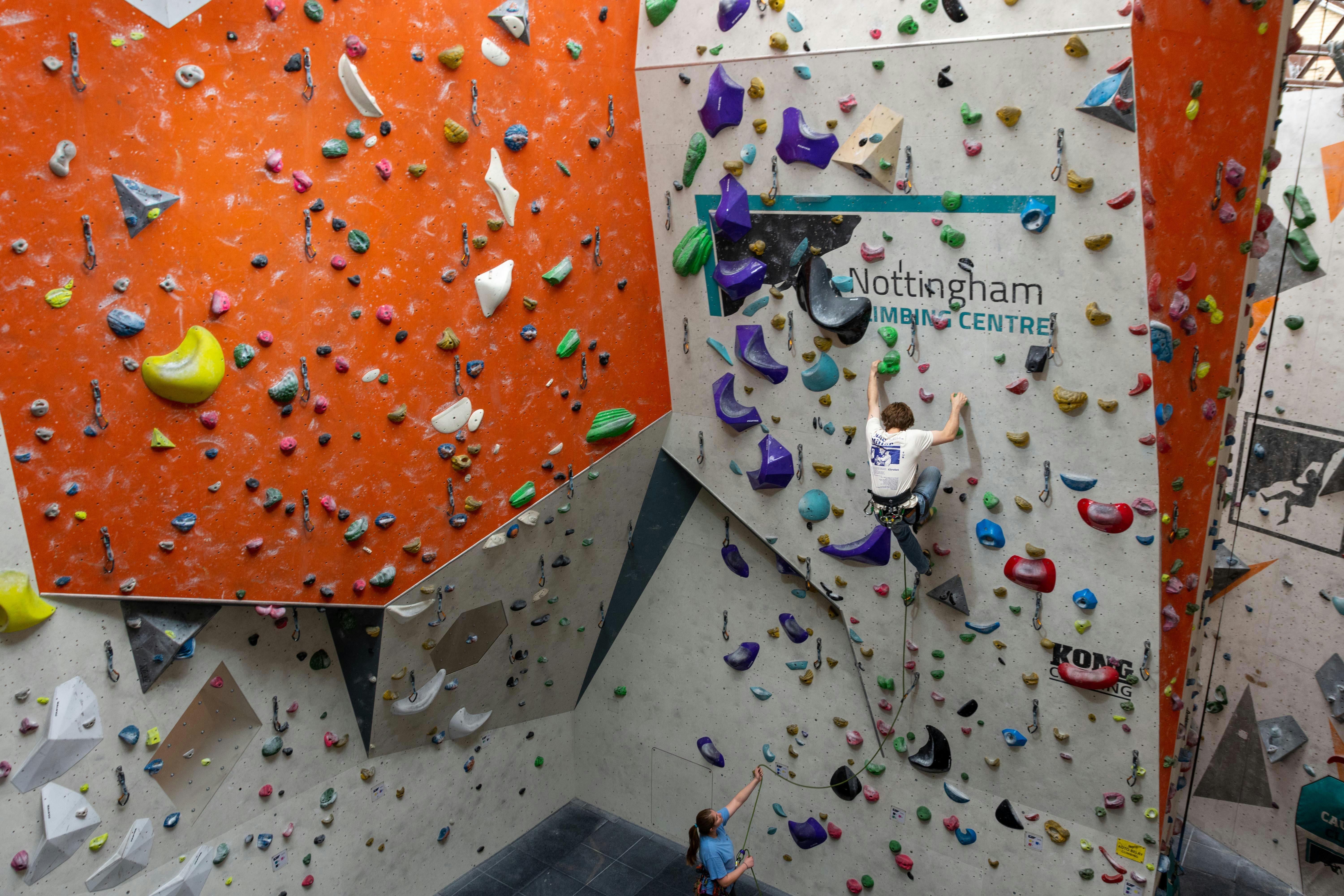 Climber on a lead climbing wall