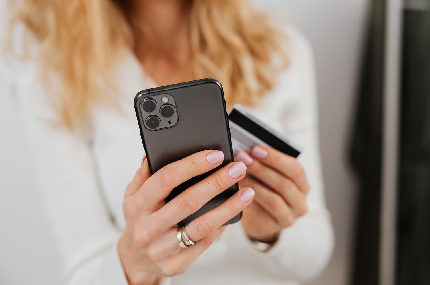 Woman making a payment on her mobile phone