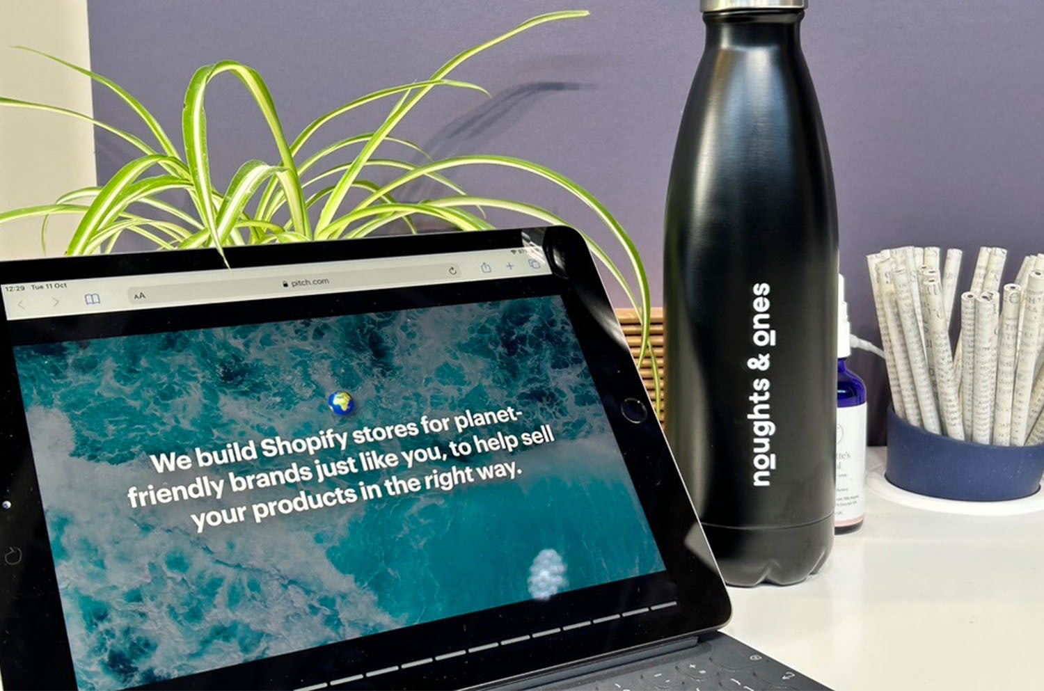 Noughts & Ones iPad and bottle at Blue Earth Summit, 2022