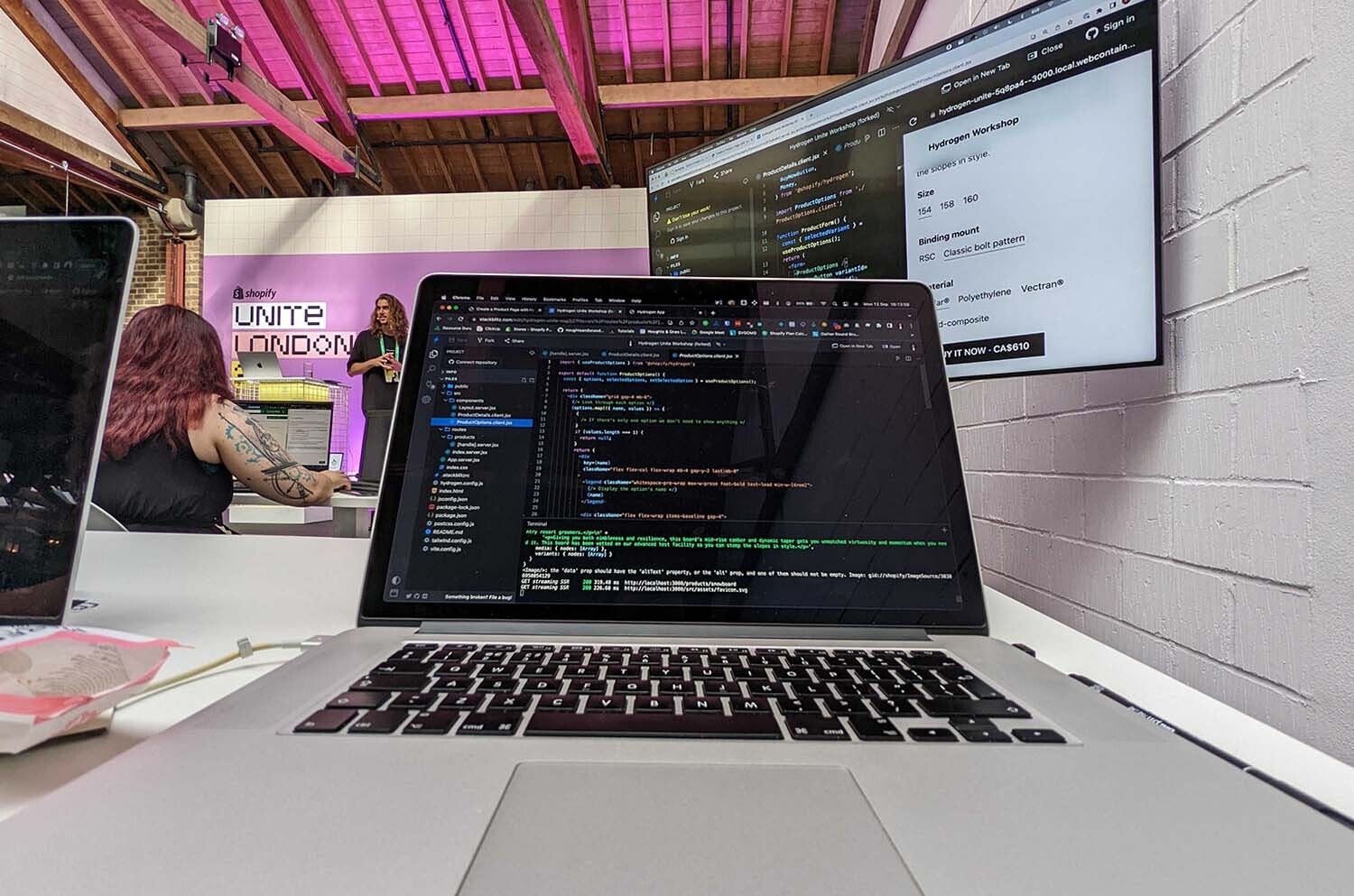 Laptop showing code at Shopify Unite workshop.