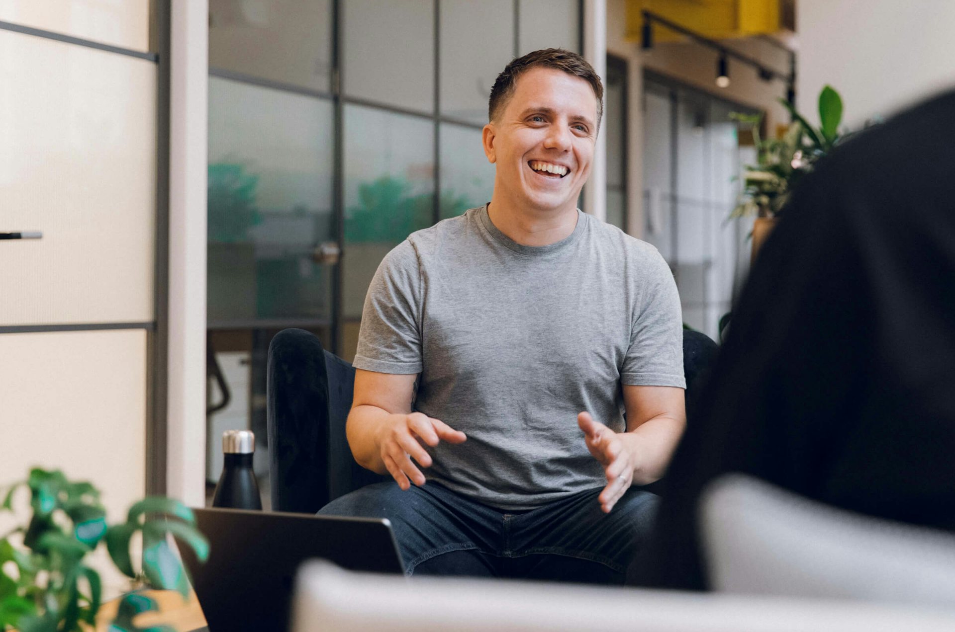 Image of Operations Director, Matthew Pill speaking with a colleague