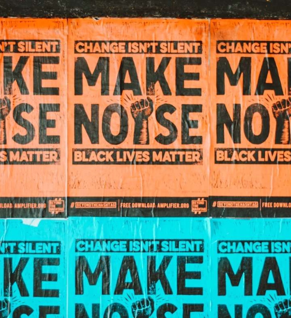 Image of Black Lives Matter posters on a public wall.