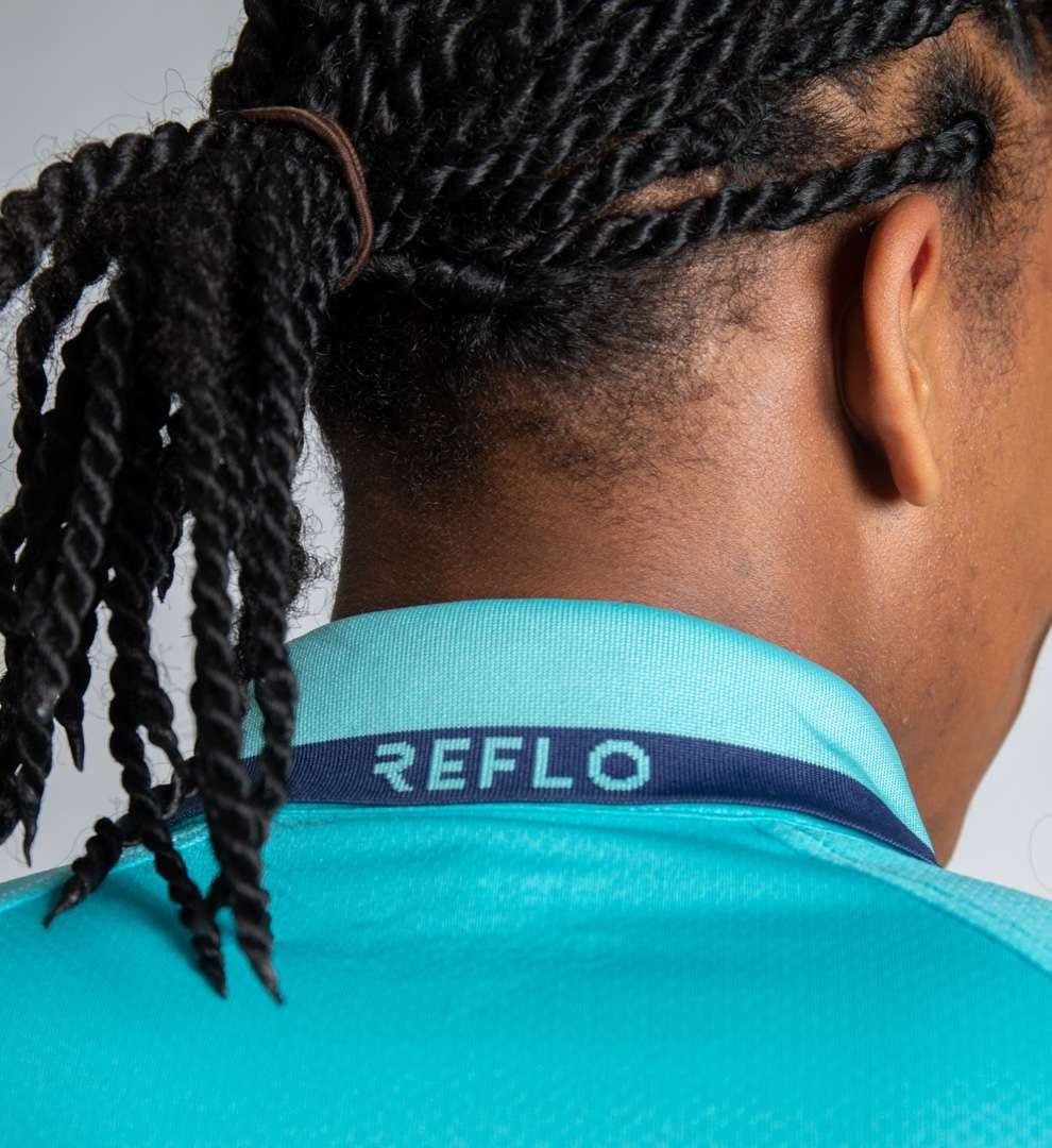 Product shot of model wearing a sports top by Reflo.