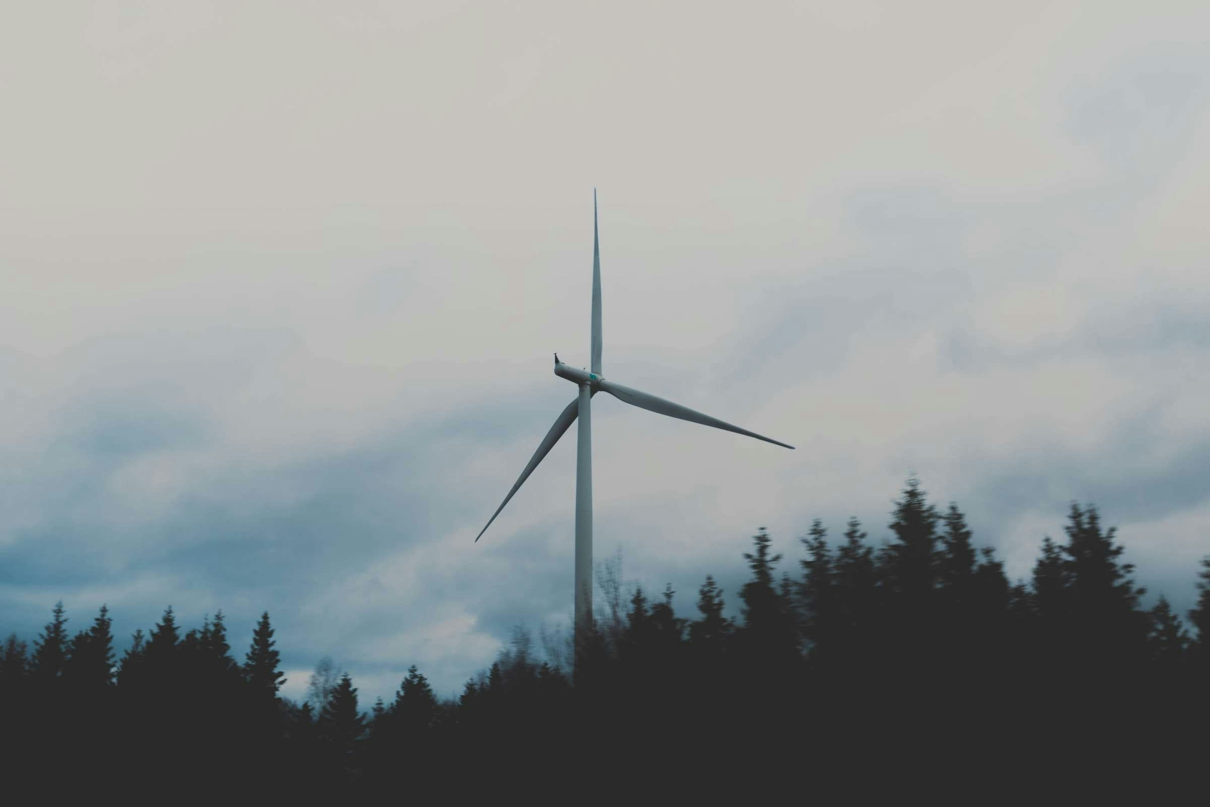 Wind turbine against a moody sky