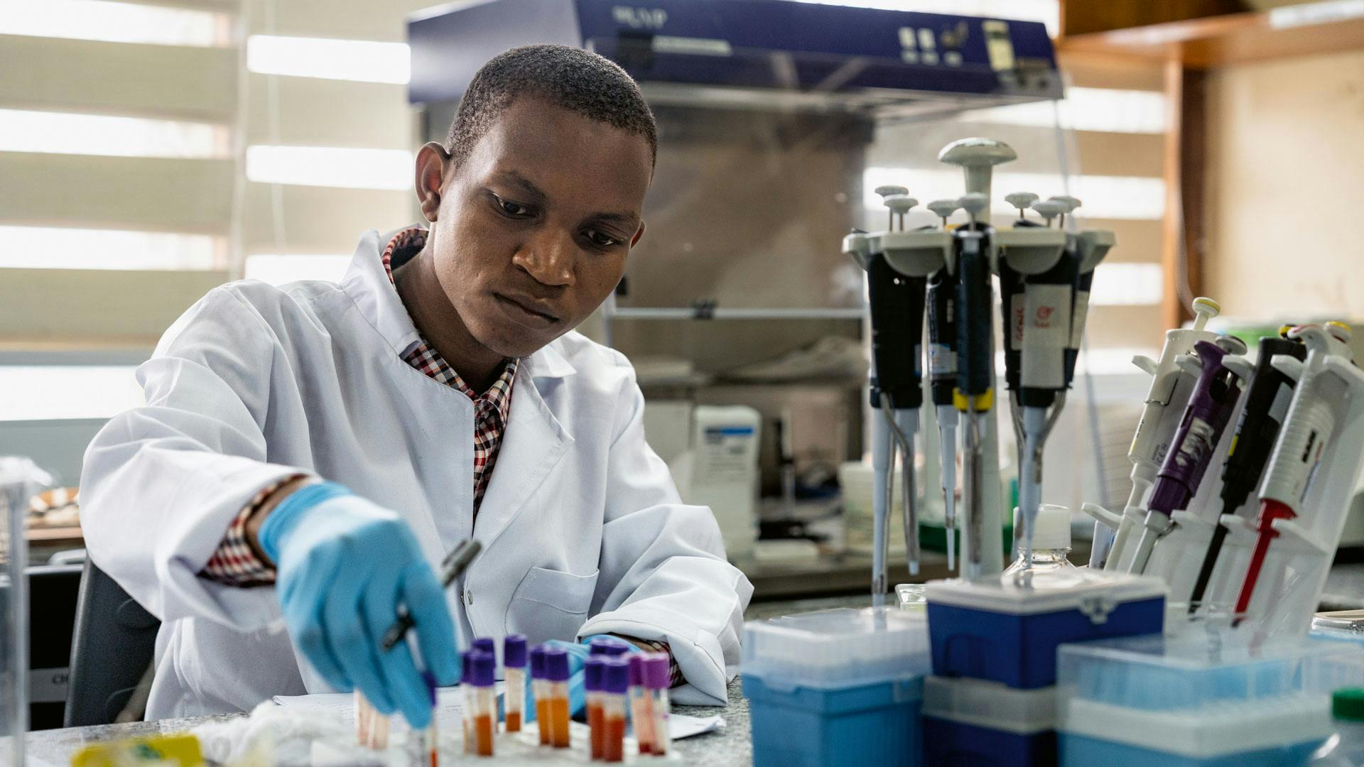 Researchers at the laboratories in Uganda and Tanzania.