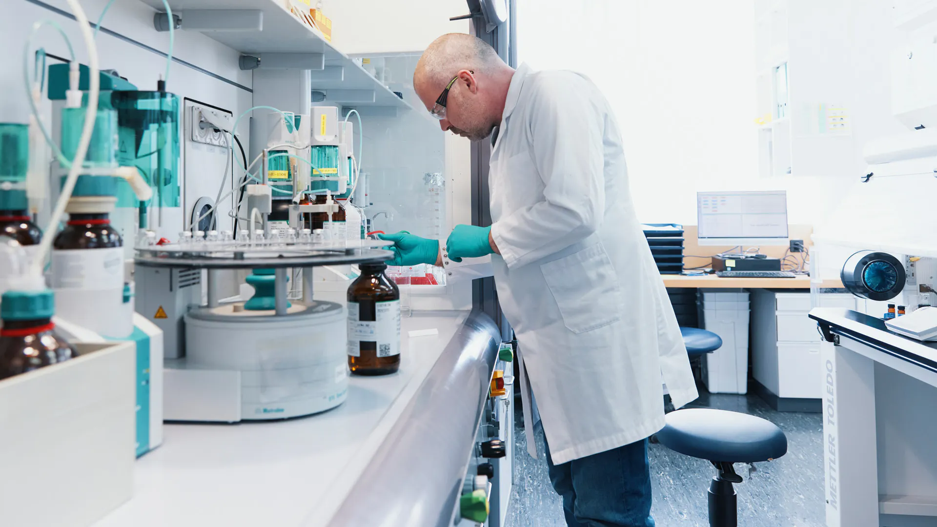Scientist working in the laboratory fume hood.