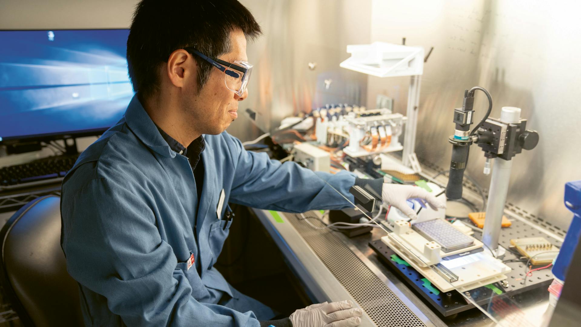 Makoto Hara setting up the camera system that will film the mini-hearts.
