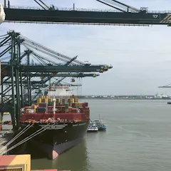 A container ship during the loading process in the port of Antwerp in Belgium.