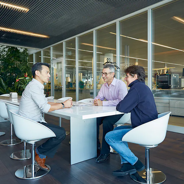 Sylvain Cottens (center) during a team meeting.