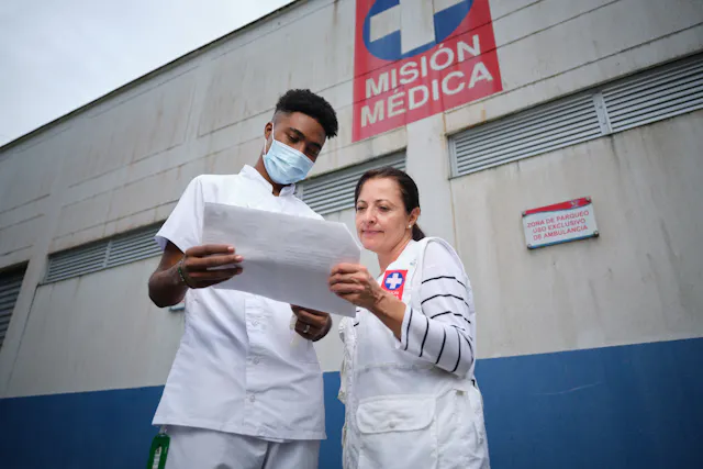 Alexandra says that partnerships between pharmaceutical companies, research centers, public health organizations and local communities are critical to develop new treatments and address the impact of neglected tropical diseases. Photo: Alexandra works with local healthcare professionals like Eyder Cuesta (left), pictured outside a clinic in Santa Cecilia, Colombia.