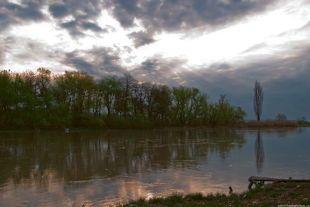 The river Mures flows gently through the Carpathians.