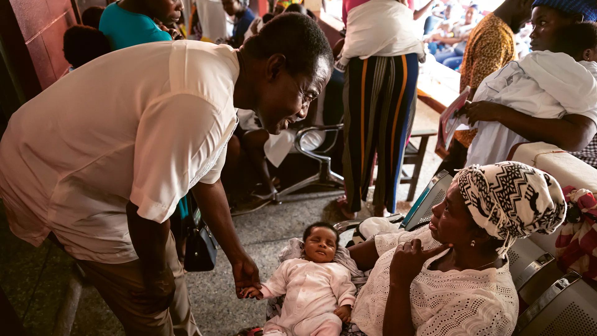 Dr. Kwaku Ohene-Frempong examining a baby in a doctor's office practice in Ghana. 