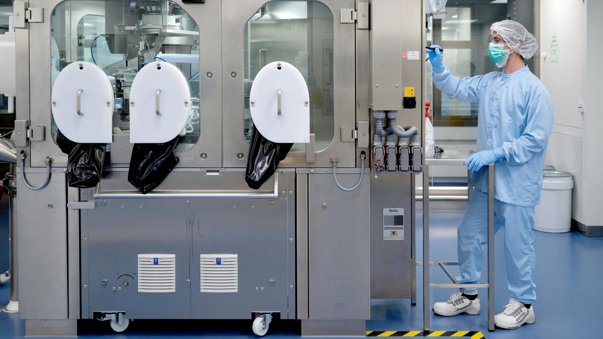 Scientist operates machine