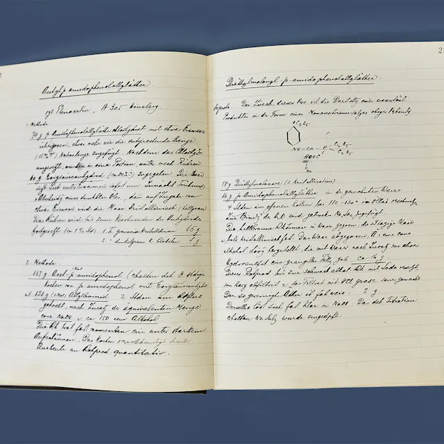 Handwritten documentation of synthesis experiments in a researcher’s laboratory notebook.