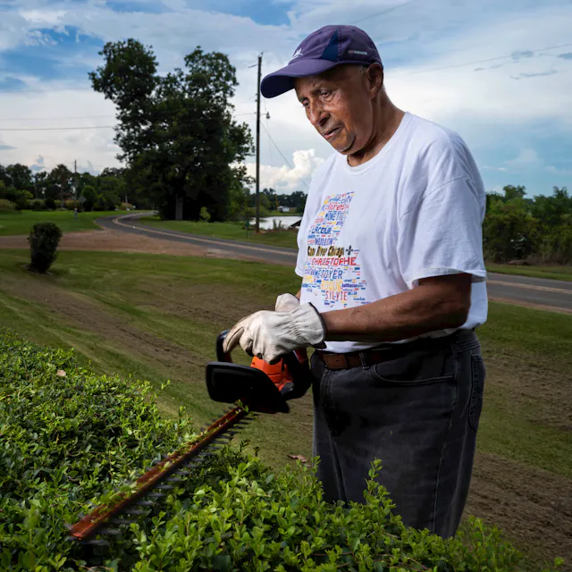 Van is seen cutting his hedge. Although his illness means he still sometimes feels fatigued, Van says he has more energy these days to do the things he enjoys – like working in his garden.