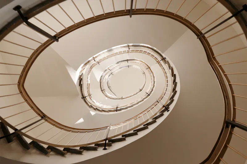 Staircase in the IOB viewed from the groundlevel circeling its way to the top.