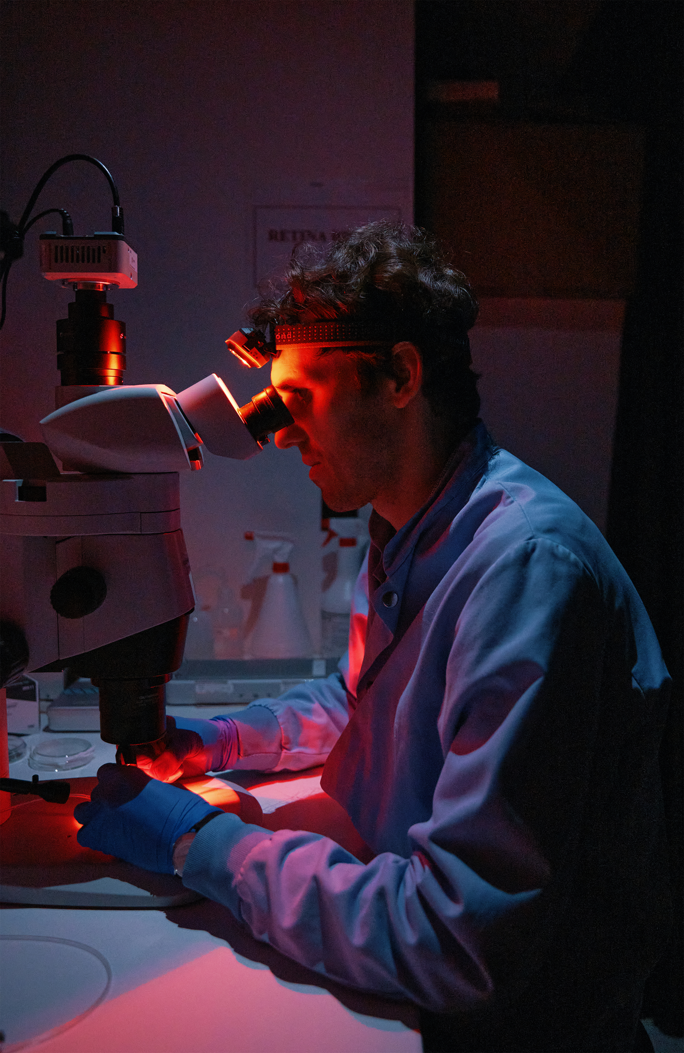 Matej Znidaric in the dark working on his sensor apparatus.