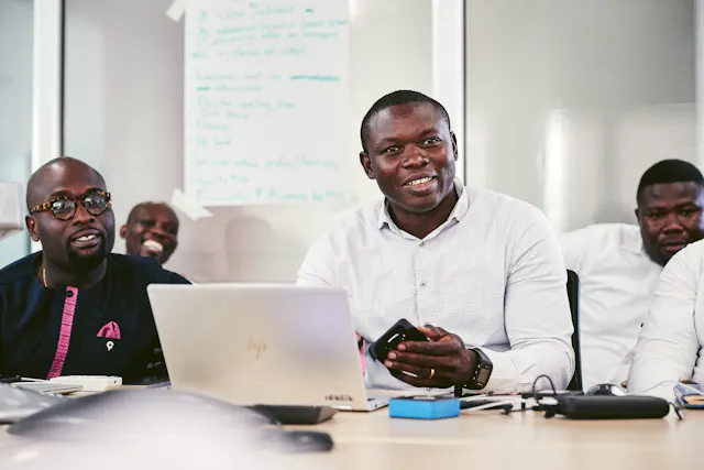 Théophile Sebgo with associations in a meeting room.
