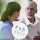 An older Black man talks to a health care provider. PsA Action Month 2023 graphic overlaid.