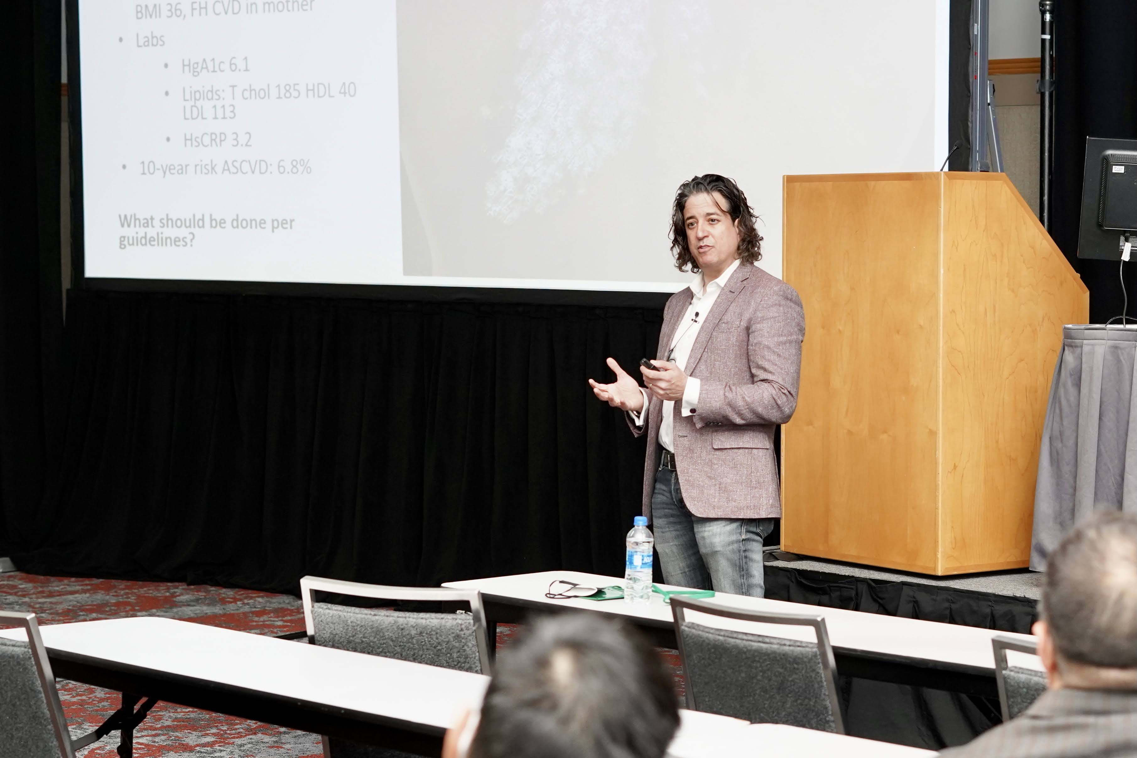 Joel Gelfand gives a presentation at SID 2022