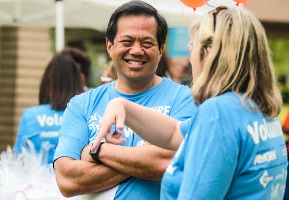 NPF volunteers interact during an event outside. 