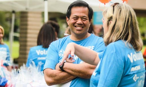 NPF volunteers interact during an event outside.