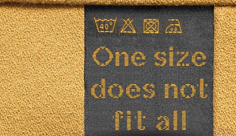 Clothing label that reads "One size does not fit all"