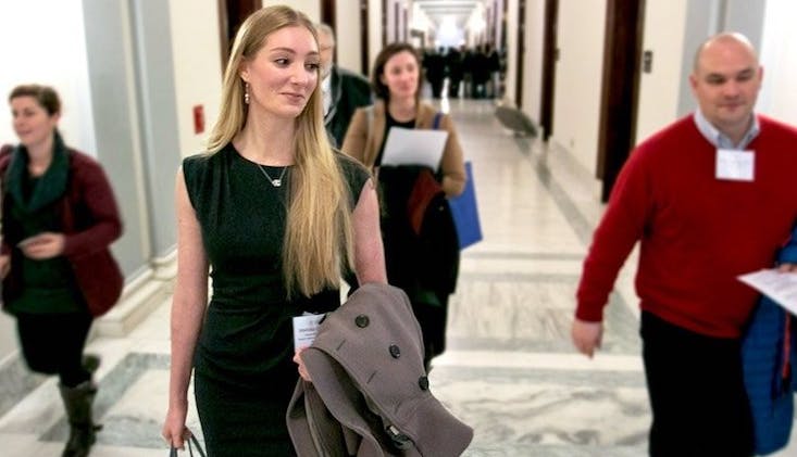 Woman walking with work bag