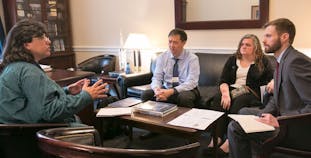 Advocates sit and discuss how to improve health options for psoriasis and psoriatic disease patients. 