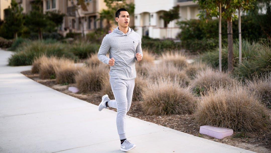 Man running on sidewalk