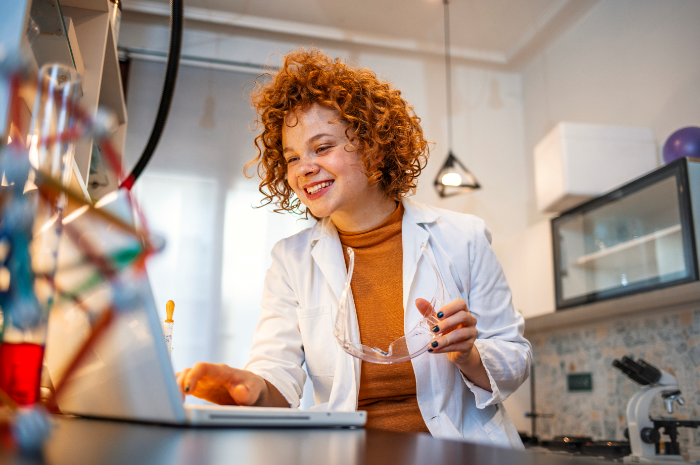 A female researcher working on a computer in a lap