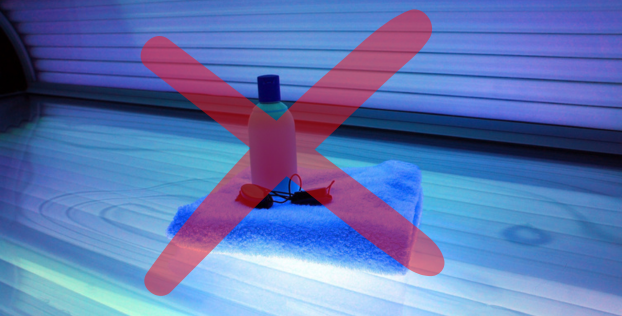 A picture of a tanning bed, towel, glasses, and lotion with a red X overlaid.