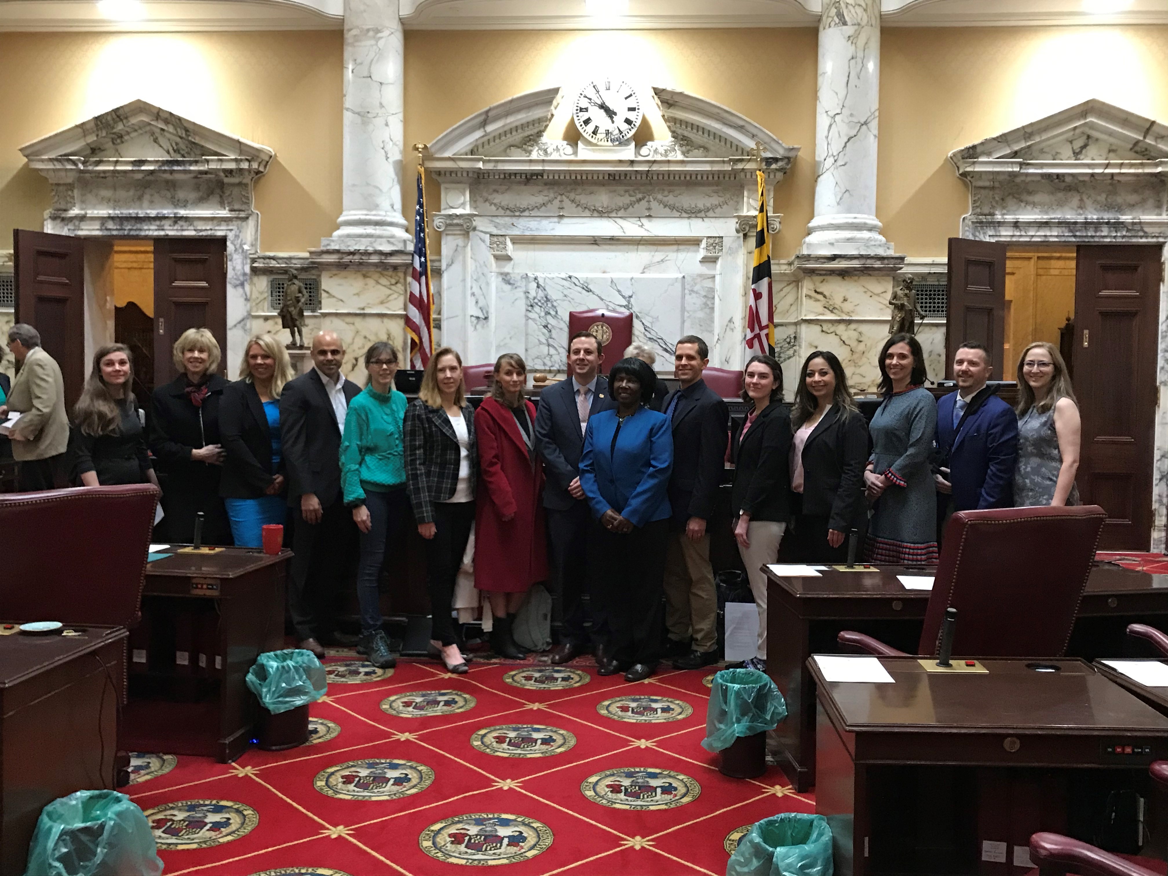 Advocates standing together in a legislative building.