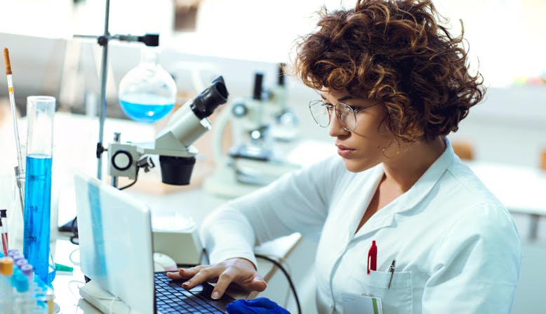 Woman working on computer in a lab