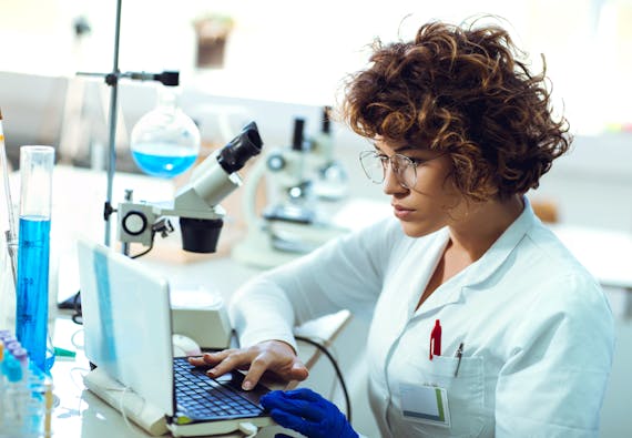 Woman working on computer in a lab
